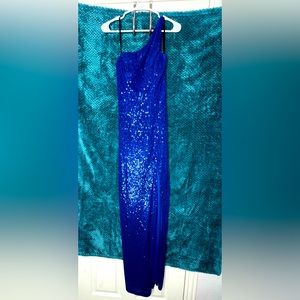 One shoulder long blue sequined dress with high slit on the leg. Worn once!!!